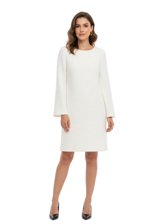 Woman wearing a white dress with long sleeves on a white background
