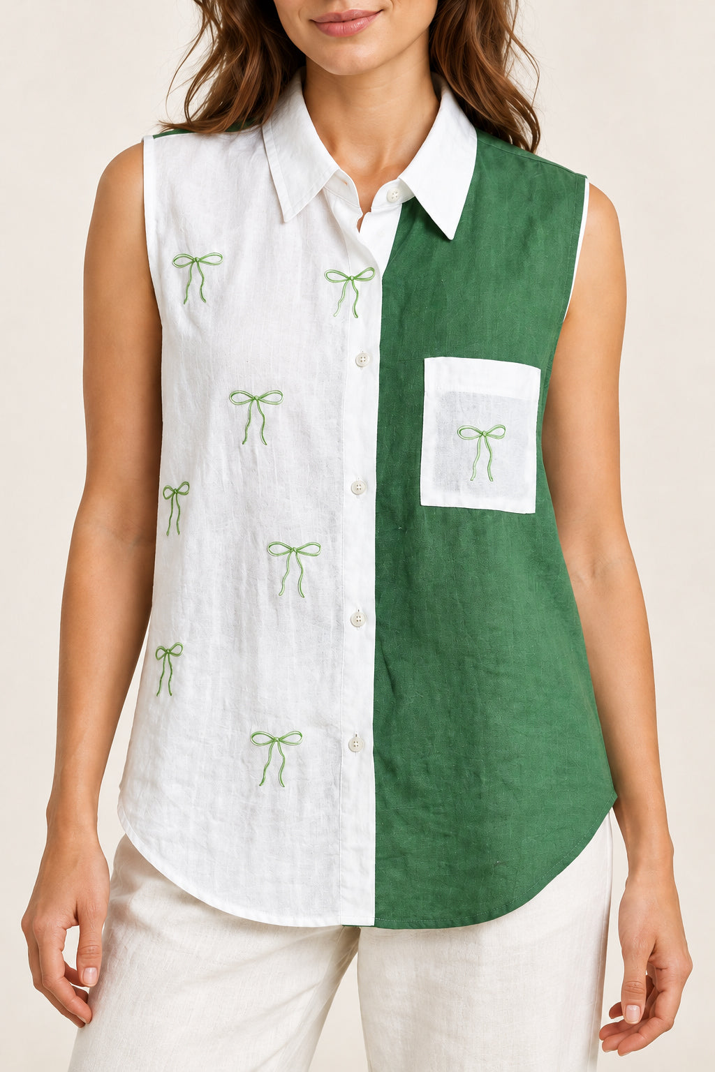 Green and white bow shirt on the same model, front detail