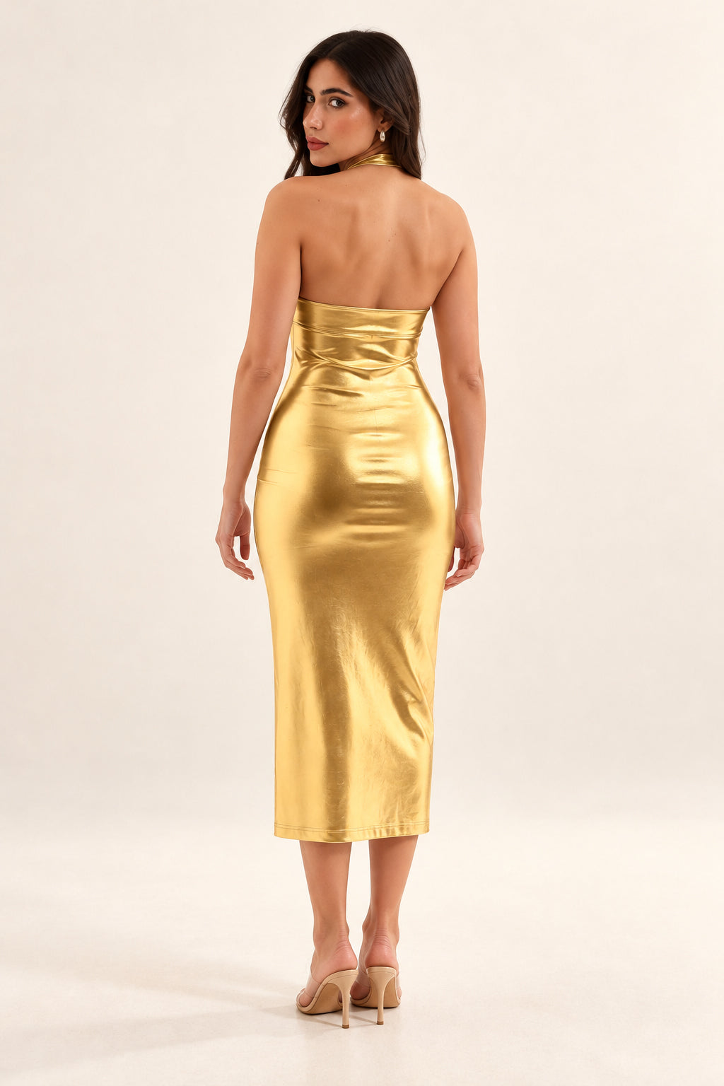 Lunar Luxe gold metallic halter midi dress on the same model, back view