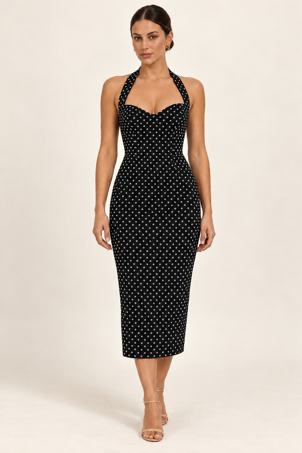 Midnight Polka Dot Halter Dress on a model in an ivory studio, front view