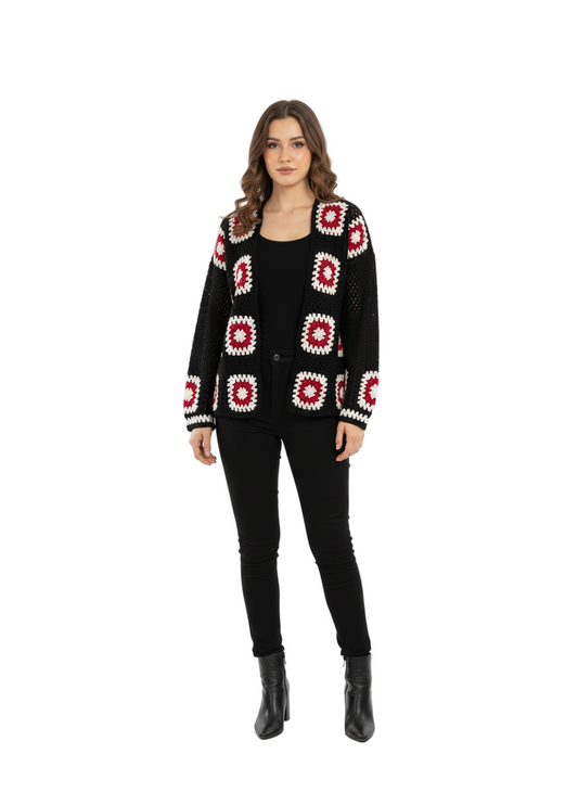 Woman wearing a black cardigan with red and white pattern on a white background