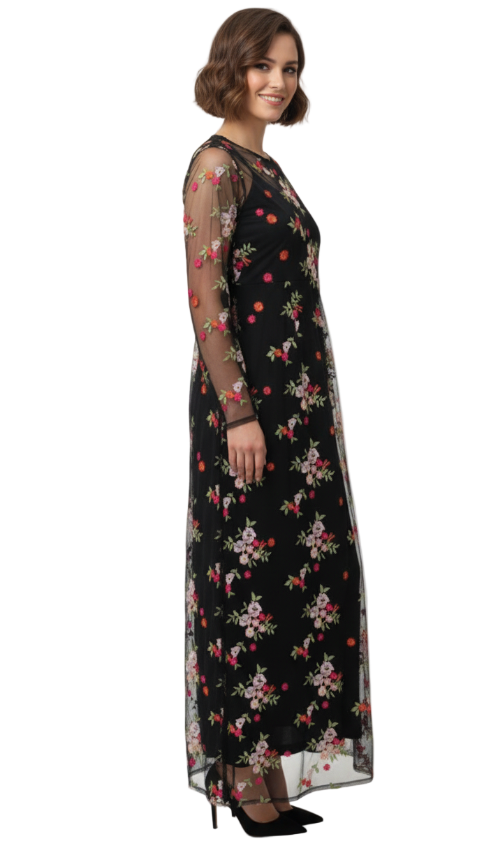Woman wearing a black floral dress on a white background