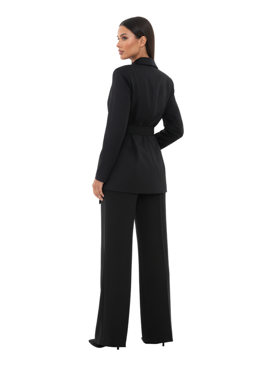 Woman wearing a black suit on a white background