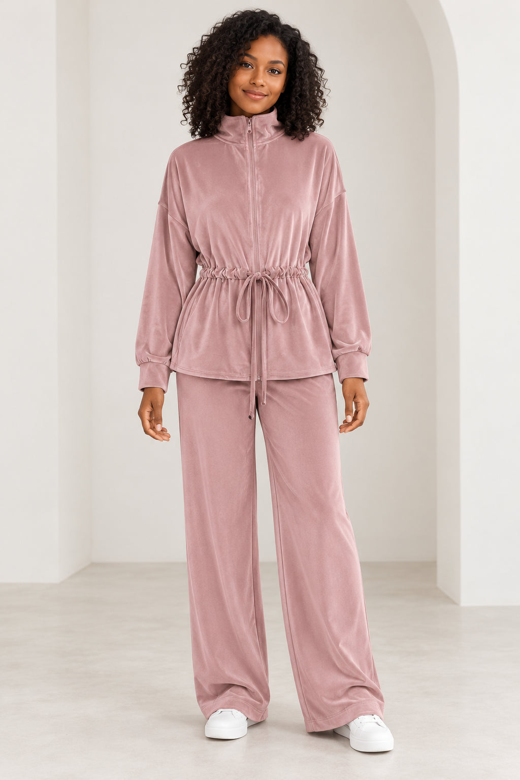 Model wearing the FD Basics Dusty Pink zip-neck drawstring top and matching wide-leg trousers.
