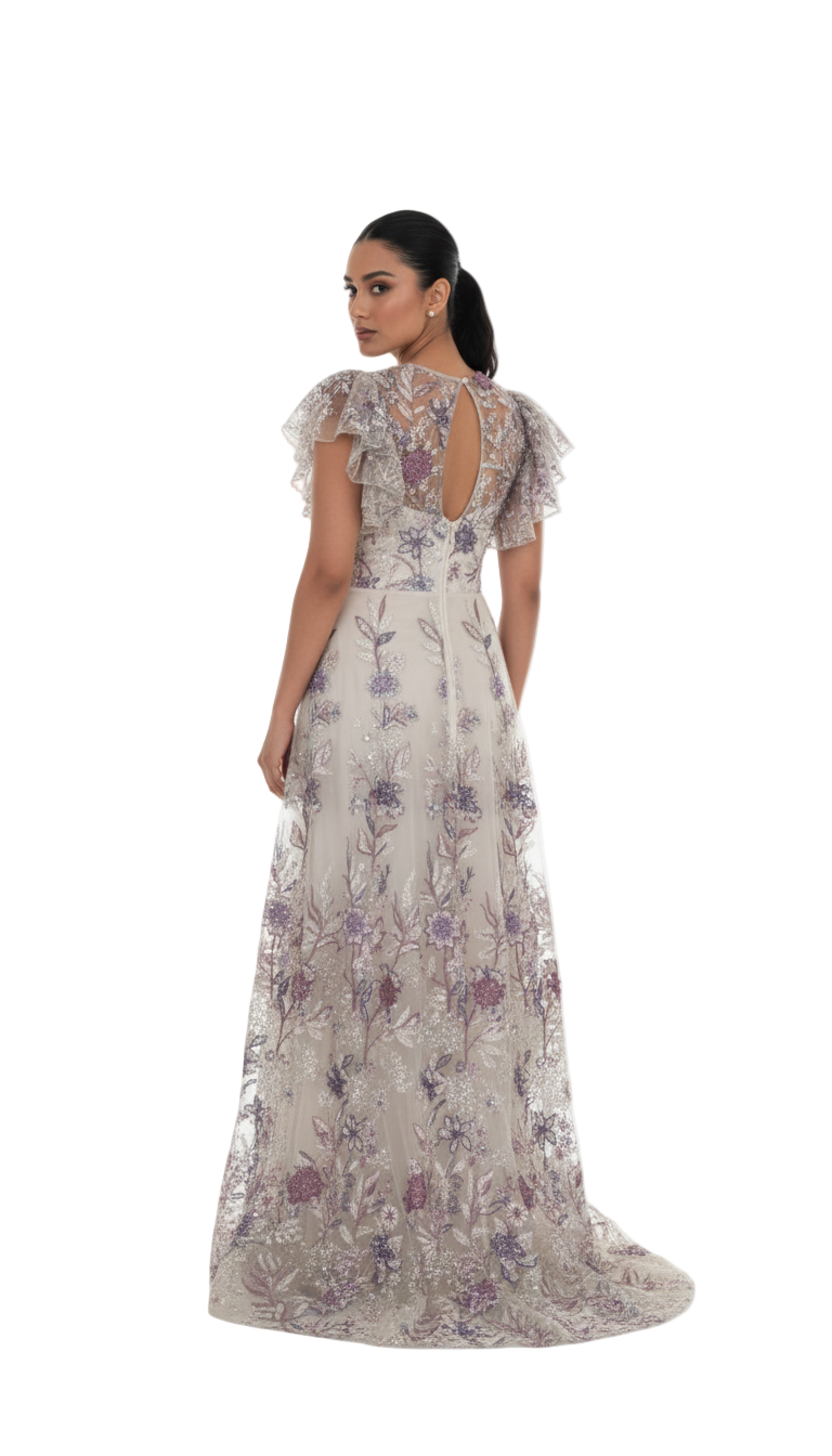 Woman wearing a floral evening gown on a white background