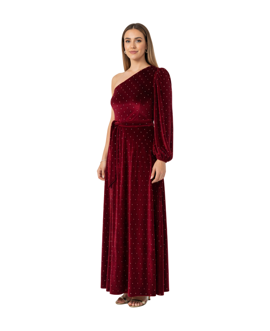 Woman wearing a burgundy one-shoulder dress with long sleeves on a white background