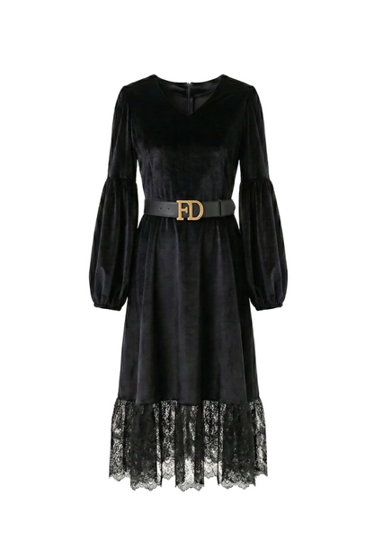 Black dress with lace hem and gold belt on a white background