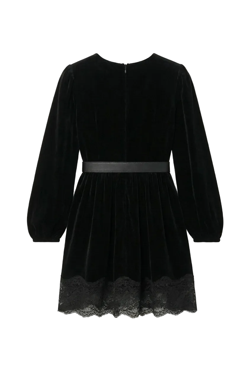 Black velvet dress with lace hem on a white background