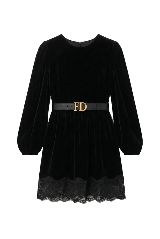 Black velvet dress with lace hem and gold belt on a white background