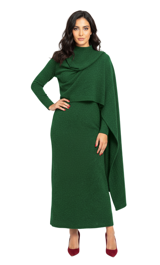 Woman wearing a green dress with a cape on a white background
