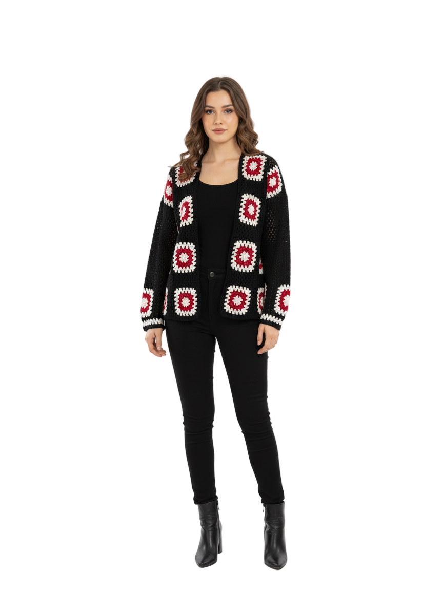 Woman wearing a black cardigan with red and white pattern on a white background