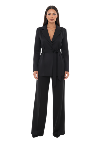 Woman wearing a black suit on a white background