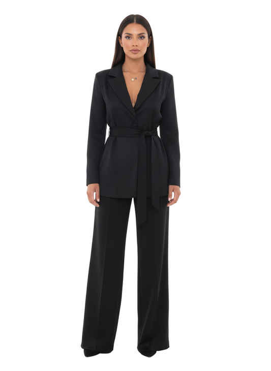 Woman wearing a black suit on a white background