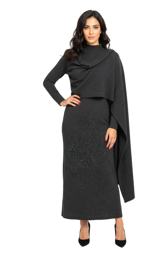 Woman wearing a black dress with a draped design on a white background