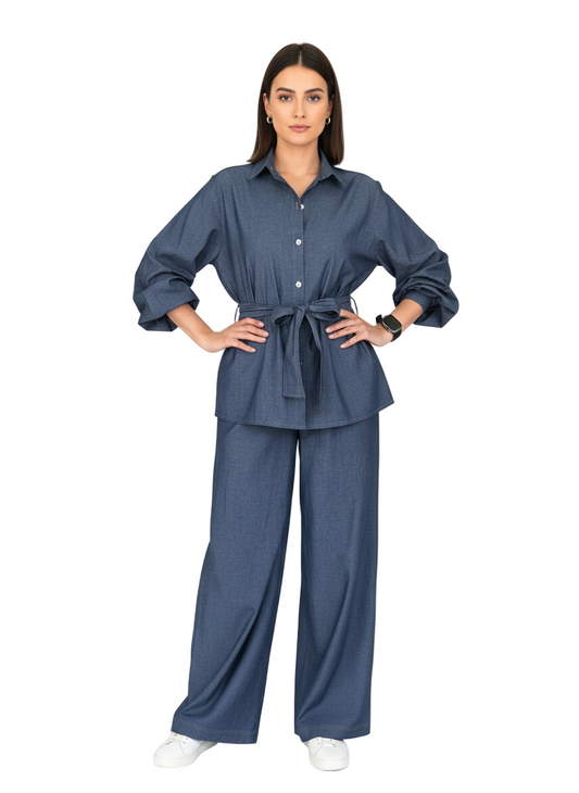 Woman wearing a blue denim outfit on a white background