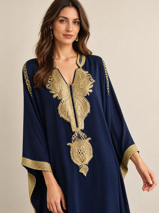 Majestic Navy Kaftan on a model, showing the gold embroidered neckline and cuffs
