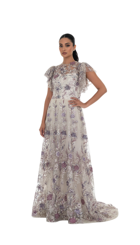 Woman wearing a floral evening gown on a white background